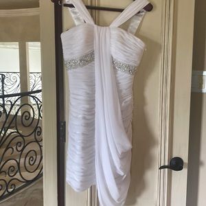 White cocktail dress with rhinestone embellishment and sheer draping in front
